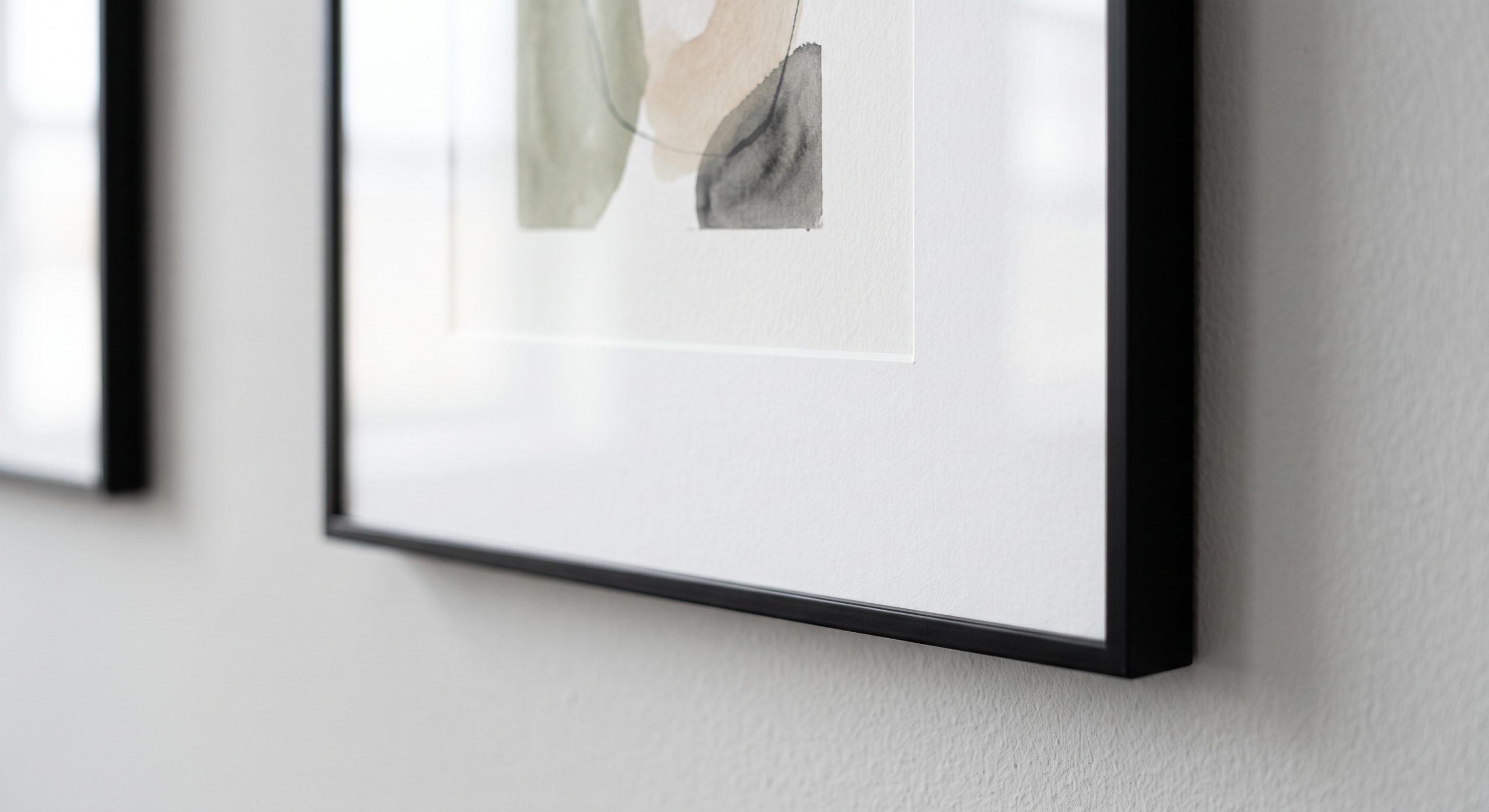 Close-up of a framed print with a generous white mat border around the artwork