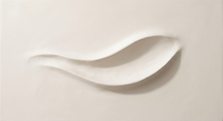 Close-up of a bas relief abstract artwork with a shallow raised organic form emerging from a flat ivory background