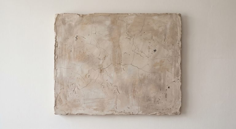 Wabi-sabi inspired abstract artwork with an aged clay-toned plaster surface and hairline cracks