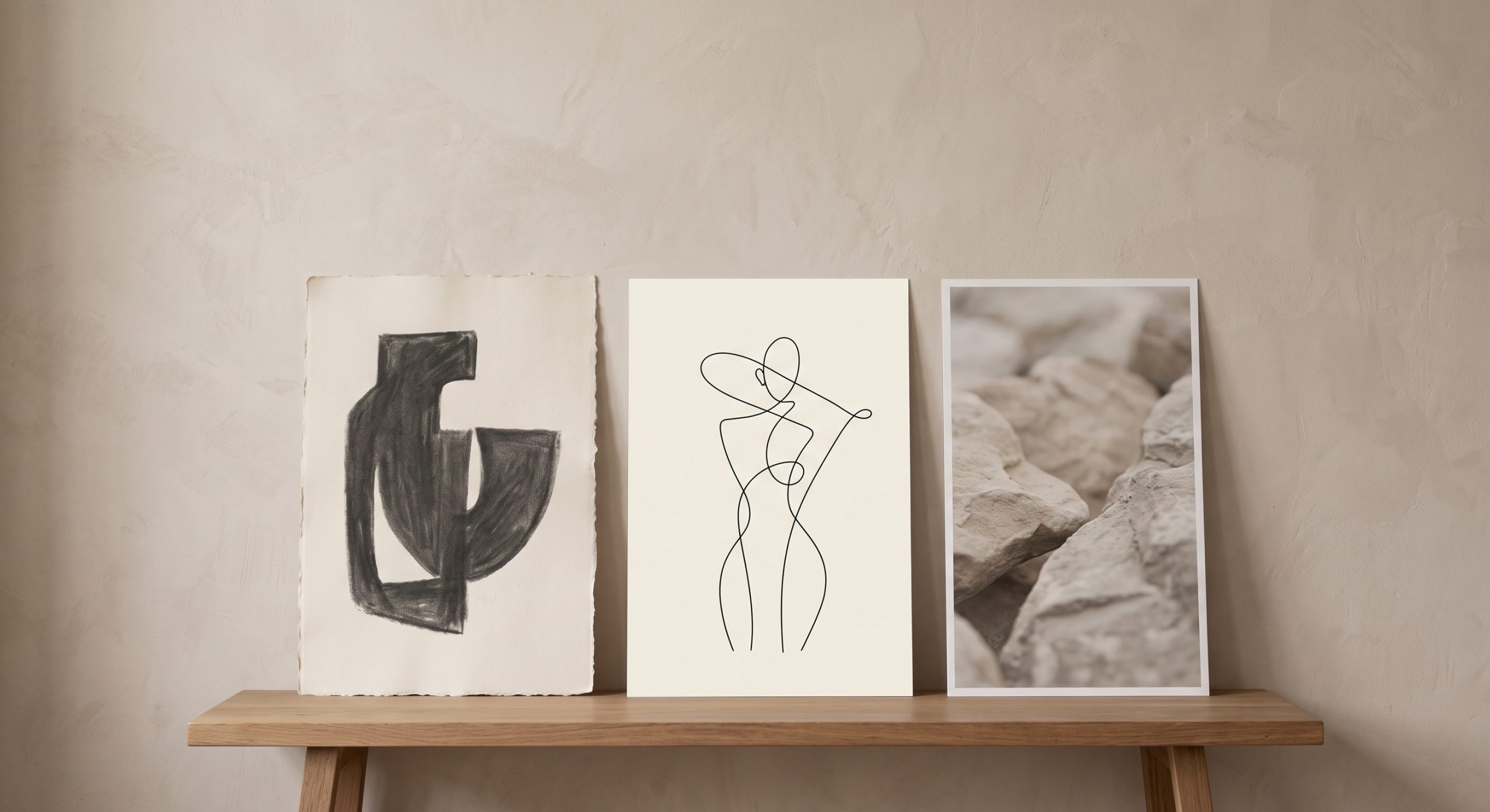 Three artworks propped against a wall showing a deliberate mix of styles in one palette