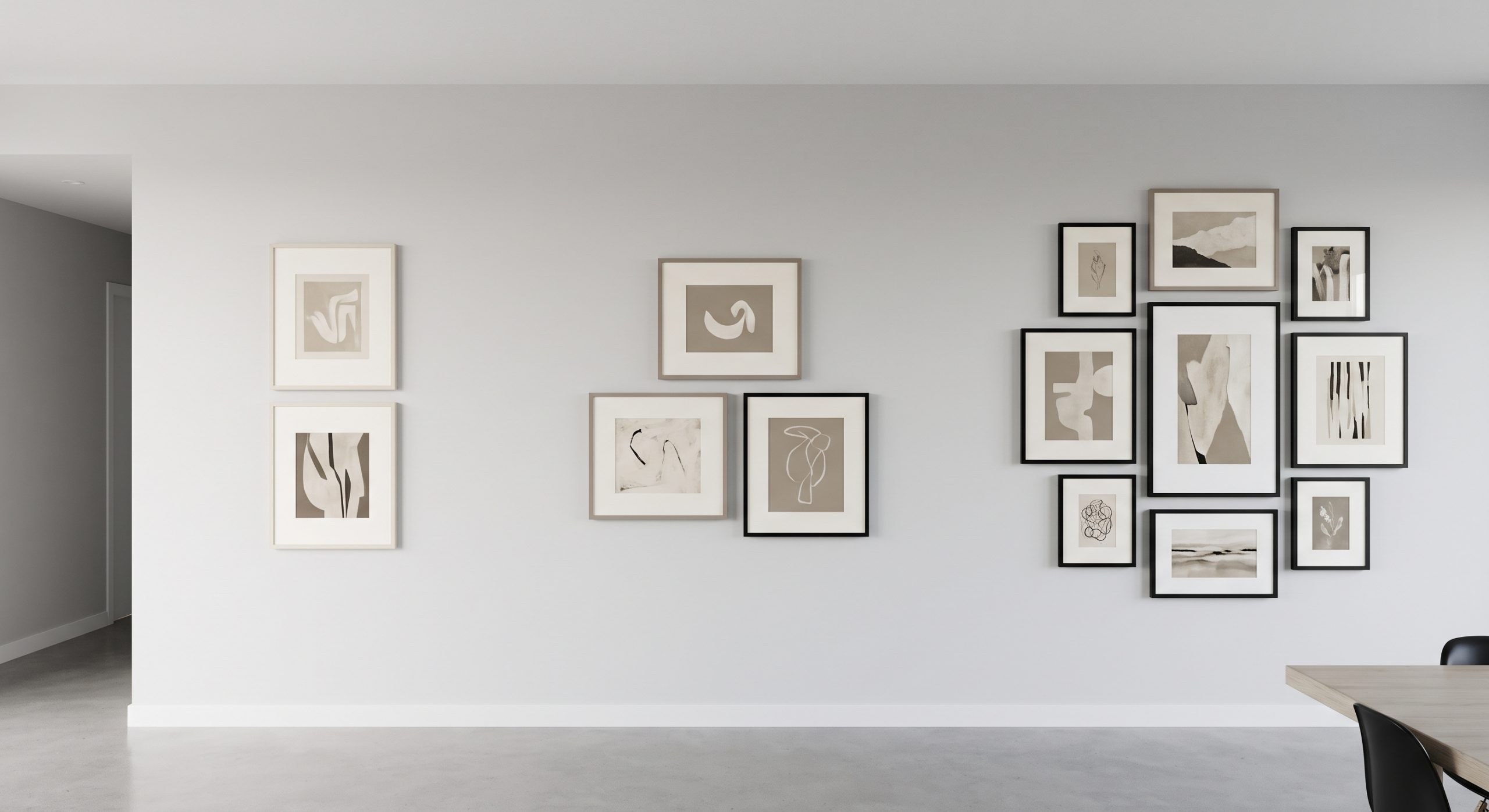 Three gallery wall groupings on one wall: a pair, a trio and a cluster of seven