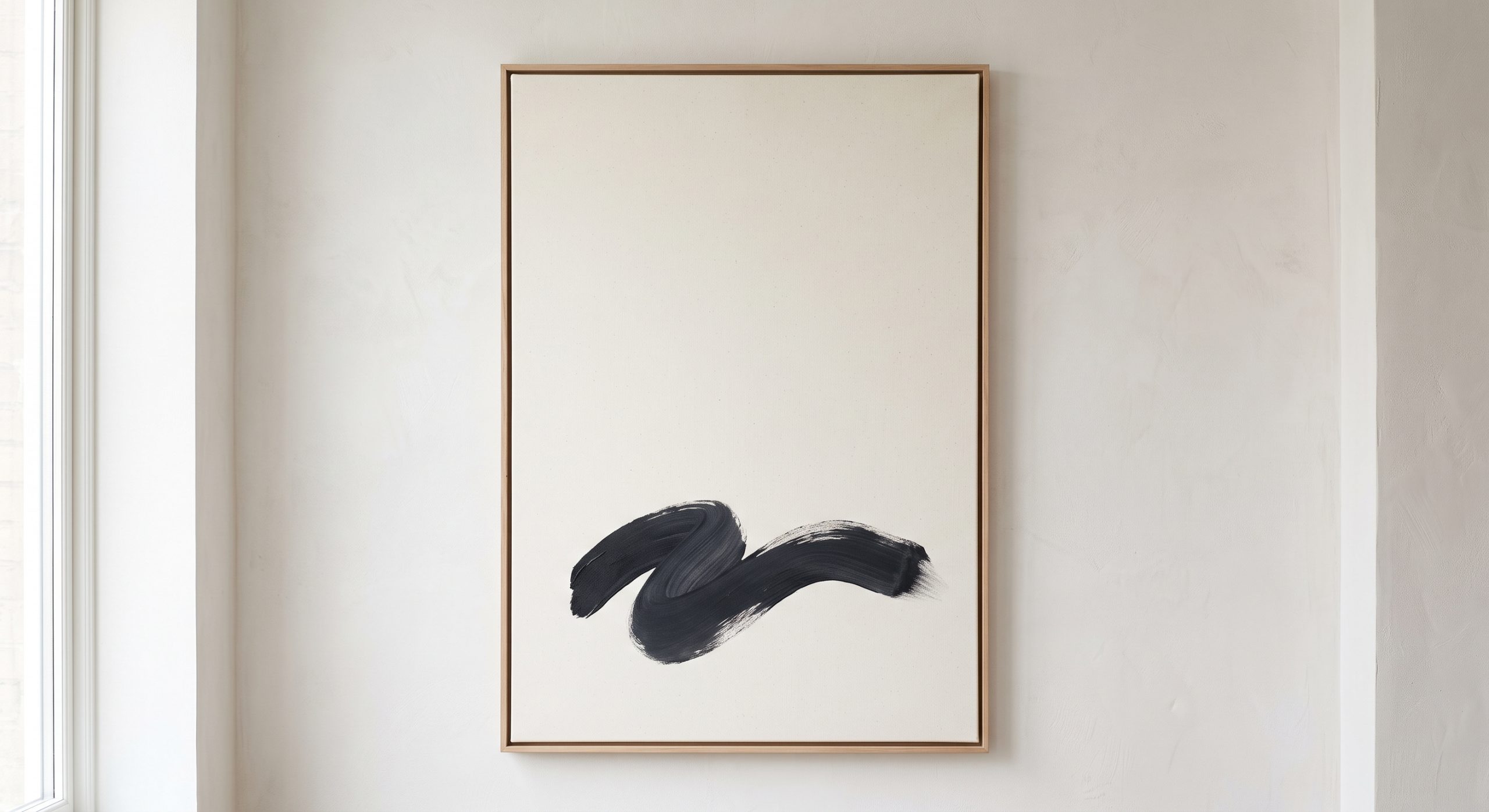 Textured neutral abstract artwork on a plain wall