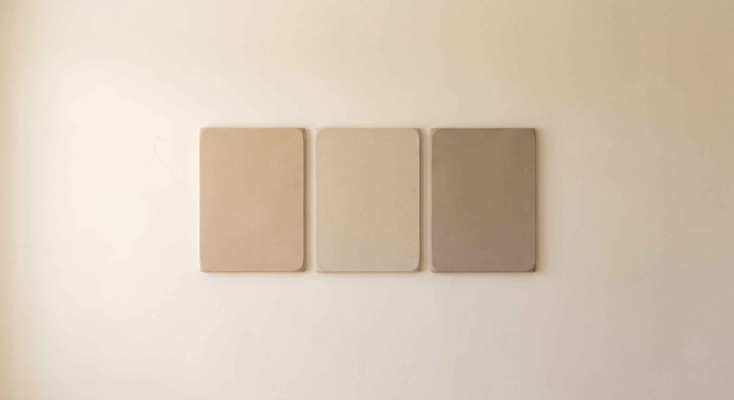 Minimalist artwork with a single fine horizontal line on a large ivory surface